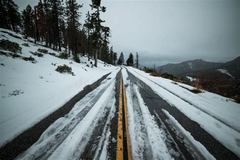 Dangerous Uncleared Slippery Asphalt Winter Road With Snow In Mountains