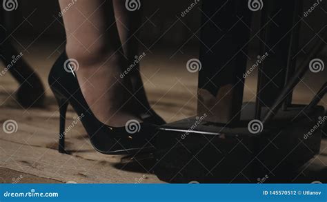 A Woman Plays Piano In The Concert Hall Close Up Of Feet In Shoes