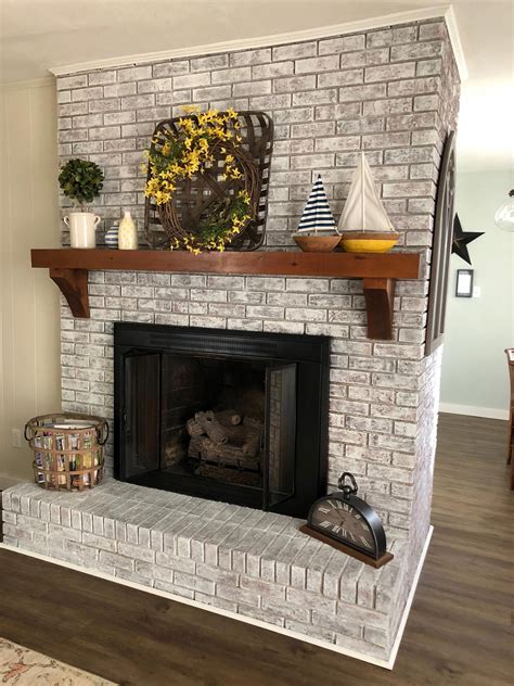 The red tone of the brick is covered but the texture still shows. Painted brick fireplace SW Pure White over dark red brick ...