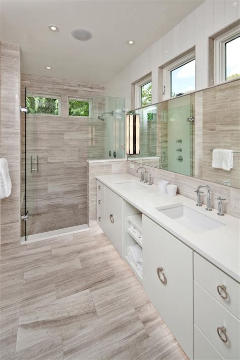 Once you've coordinated your walls, your floors, and your shower tiles, it's time to let your cabinets in on the fun. Gray and White Modern Spa Bathroom With Walk-In Shower | HGTV