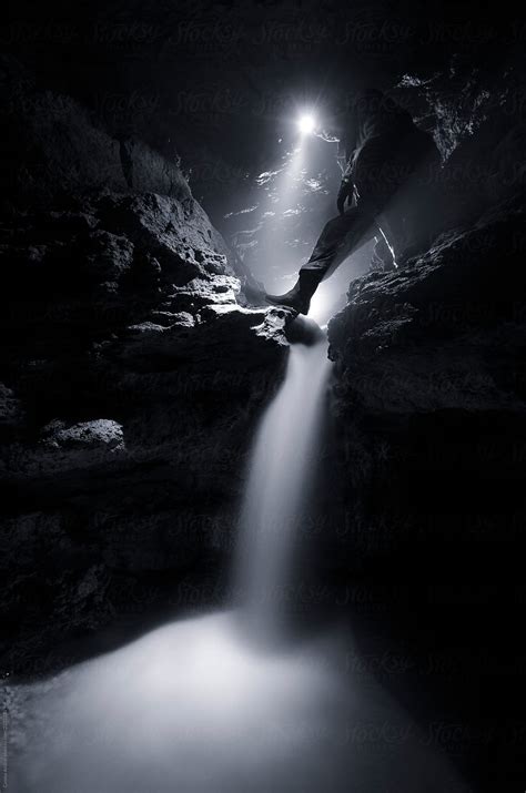Underground Waterfall In Cave With Man By Stocksy Contributor Cosma