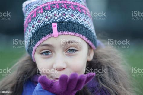 Portrait Of A Little Girl In Winter Clothes Stock Photo Download