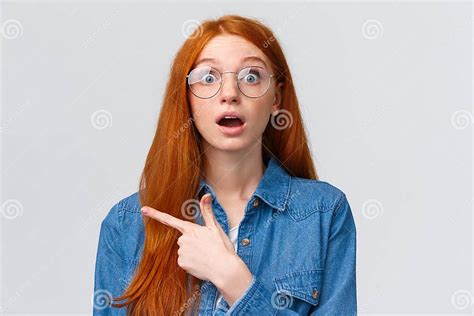Surprised And Wondered Amused Attractive Redhead Woman In Glasses Red
