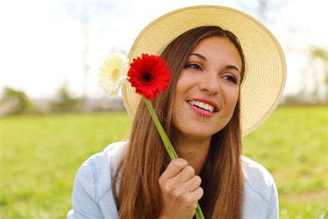 Joyful Pretty Romantic Girl Holds Two Flowers In Her Hand Smile And