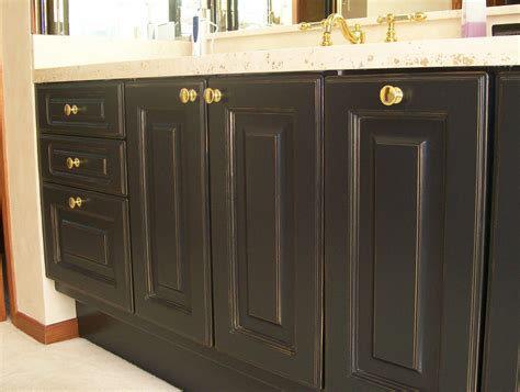 Cabinets can be sprayed in place or uninstalled, whichever is more convenient. Transforming Stained Oak Cabinets into Black Beauties with ...