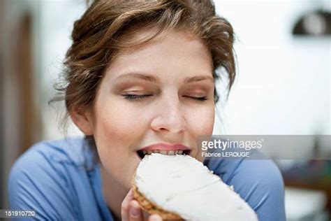 eating cream cheese photos and premium high res pictures getty images