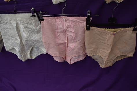 a collection of vintage corselettes and girdles