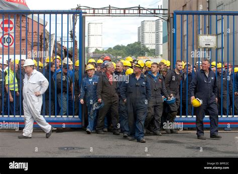 Workers At Bae Systems Govan Shipyard In Glasgow Leave Via The Front
