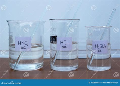 Aqueous Solutions Of Mineral Acids In Three Beakers Of Different Volumes With Formulas And