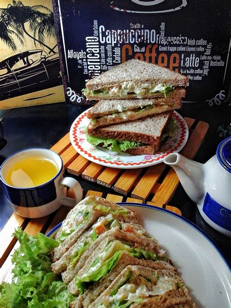 Bread, canned tuna, cucumber, eggs, ground black pepper, kosher salt, lettuce, mayonnaise, onion, radish sprouts. Sandwich Tuna & Telur
