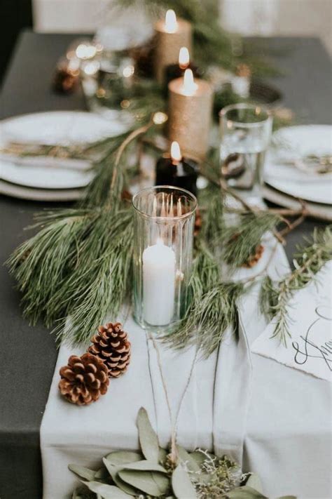 Winter Wedding Ideas For A Winter Tablescape Of Plates Candles Fir