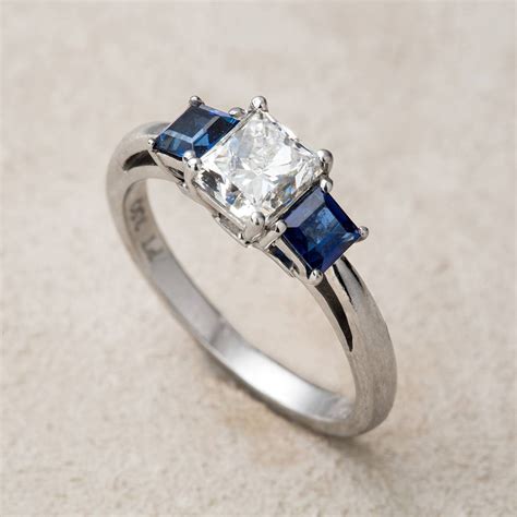 The center diamond of your choice is going to look dazzling in this vintage inspired cathedral engagement ring crafted in quality 14 karat white gold. H1912: Handmade Contemporary Diamond & Sapphire Ring | Vintage Women's Engagement Ring