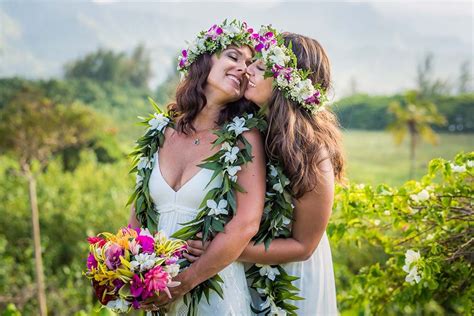 Tropical Lesbian Destination Wedding In Kauai Hawaii Filled With Colorful Flower Crowns Golden