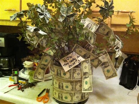Sign up to see all your money in one place. The Money Tree-made this as a wedding gift and made some of the bills into origami flowers. It ...