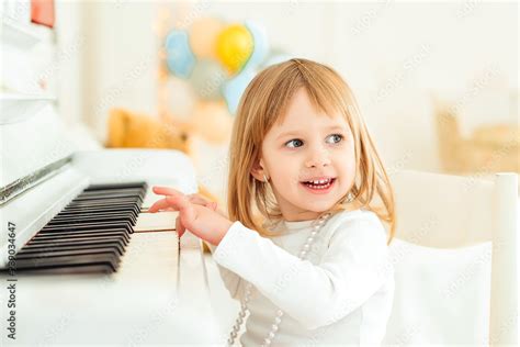Happy Child Playing Piano At Modern Class Little Girl At Musical