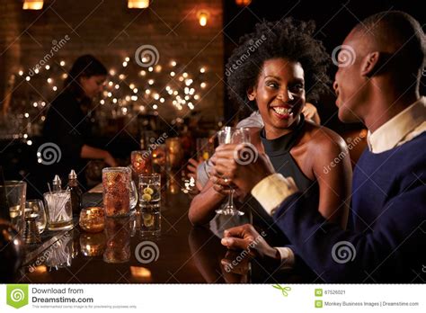 Couple Enjoying Night Out At Cocktail Bar Stock Image Image Of Dating Female 67526021