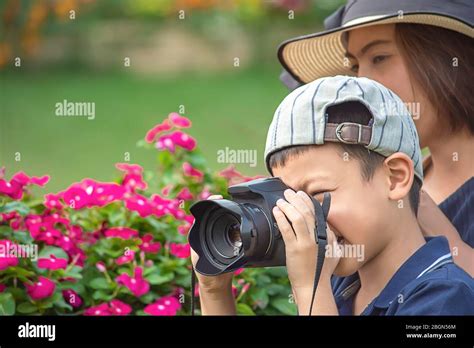 Hand Boy Holding The Camera Taking Pictures In Park Stock Photo Alamy