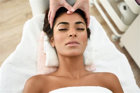 Woman Receiving Head Massage In Spa Wellness Center Stock Photo