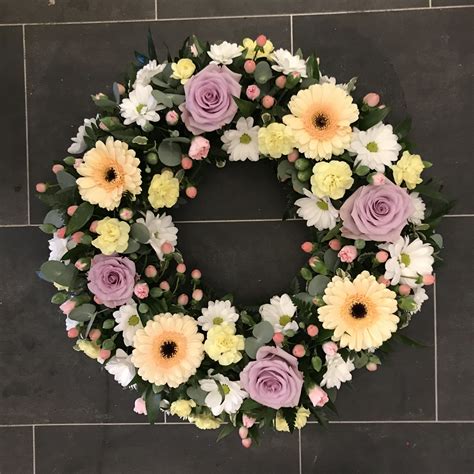 Pastel Wreath Funeral Flowers Tribute With Peach Gerbera Lilac Rose
