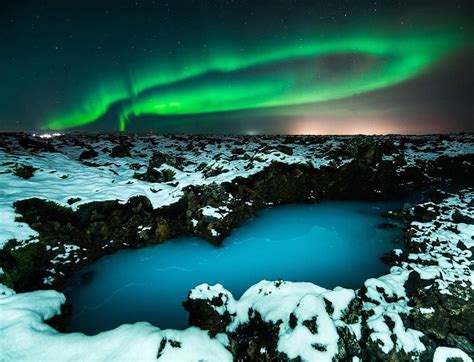 The Magical Blue Lagoon Surrounded By The Northern Lights