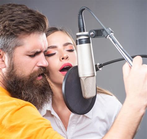 Premium Photo Singer Couple Is Performing A Song With A Microphone