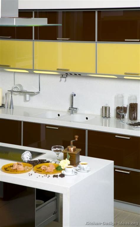 Sunny yellow kitchen cabinets make the entire house seem brighter. #Kitchen Idea of the Day: Modern Two-Tone Kitchens. Wonderful, two tone dark wood yellow ...
