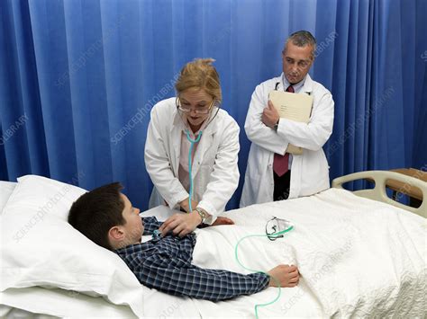 doctor examining patient in hospital stock image f005 7534 science photo library