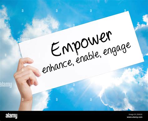 Empower Enhance Enable Engage Sign On White Paper Man Hand Holding