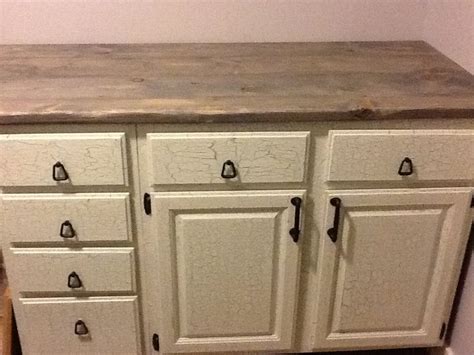 Painting your kitchen cabinets is the single most transformative thing you can do to your kitchen without a gut renovation. DIY crackle paint cupboards. DIY counter top. Pine boards distressed and stained grey. $40 for ...