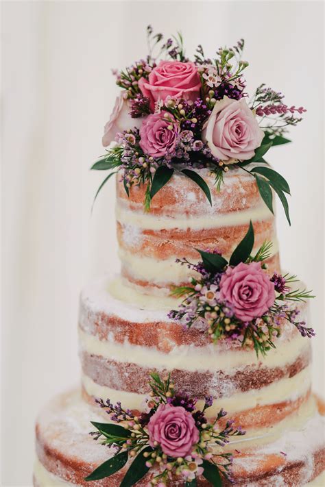 The top of the tiered cupcake arrangement is a large brown silk. Unique Wedding Cakes for The Perfect Wedding - falafelandcaviar.com
