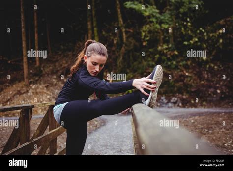 Fit Brunette Stretching Her Legs Stock Photo Alamy