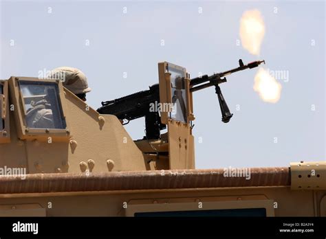 Military Humvee Mounted Machine Gun Firing Blank Rounds During Stock
