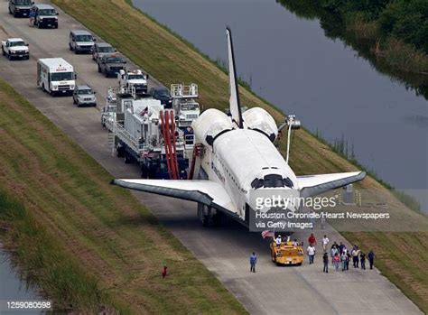 The Space Shuttle Atlantis Is Towed From The Landing Strip To The Opf