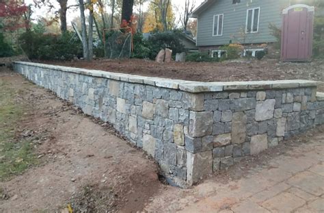 Stamped concrete is concrete that has a textured pattern combined with a mix of different colors applied to the surface to look like natural building. Retaining Walls of Atlanta | Sudlow Concrete