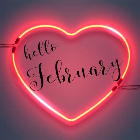 A Neon Heart With The Words Hello February Written In Cursive Writing On It