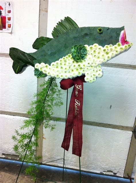 Kremp florist is located in willow. Fish Standing Arrangement #funeral #flowers # ...