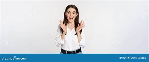 enthusiastic laughing woman smiling amused clapping hands applausing standing in formal