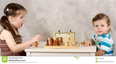 Benefits of playing chess for kids. Serious Kids Playing Chess Stock Photos - Image: 11536223