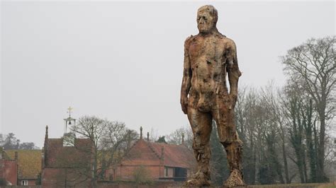 Drivers Stopping To Photograph Giant Sculpture Of Naked Yoxman Near A