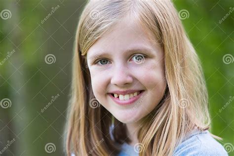 Portrait Of Smiling Pre Teen Girl Outdoors Stock Photo Image Of