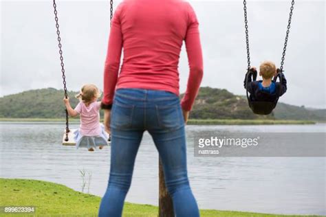 Pushing Swings Photos Et Images De Collection Getty Images