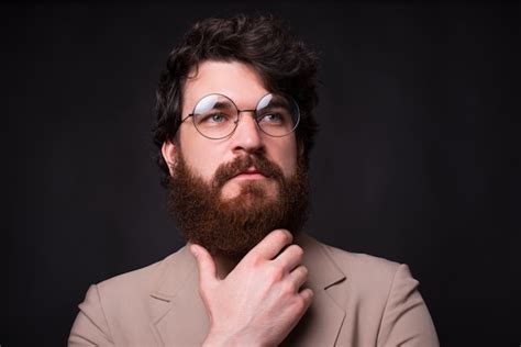 Premium Photo Close Up Portrait Of Bearded Man Wearing Eyeglasses And Looking Away