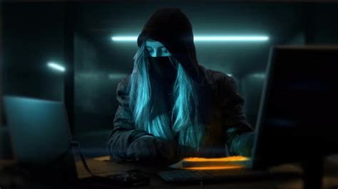 Young Anonymous Hacker Woman With Mask Thief Is Stealing Data From