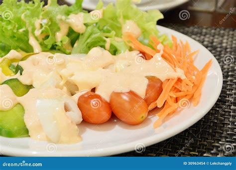 Fresh Vegetable Salad In White Bowl Topped With Thousand Island Stock