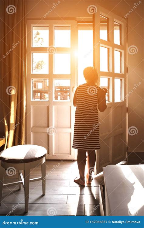 Beautiful Young Woman Standing In Doorway At Sunset Stock Image Image