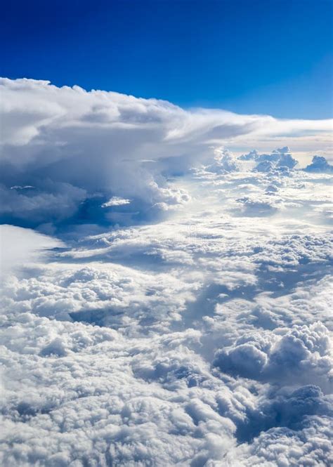 Clouds And Sky As Seen Through Window Of An Aircraft Stock Photo