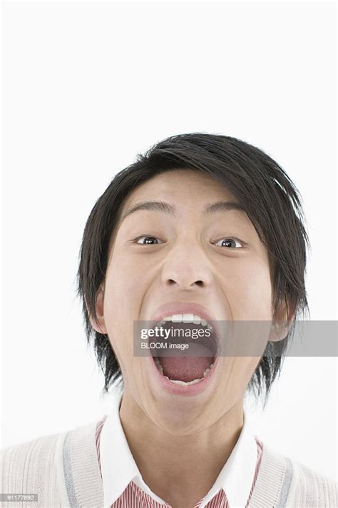 Young Man With Mouth Wide Open Portrait Closeup Studio Shot High Res
