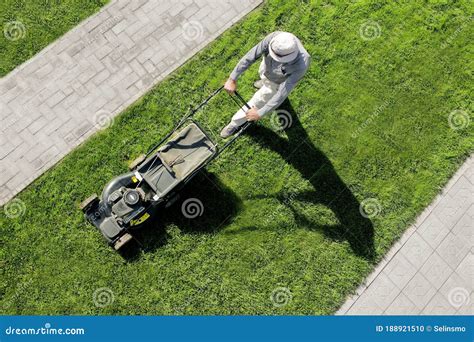 Worker Mows A Green Lawn View From Above Stock Photo Image Of