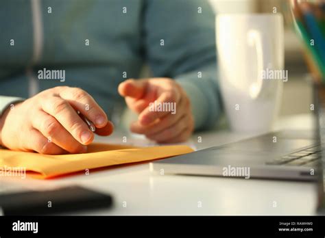 Male Hand Holding Silver Pen Stock Photo Alamy