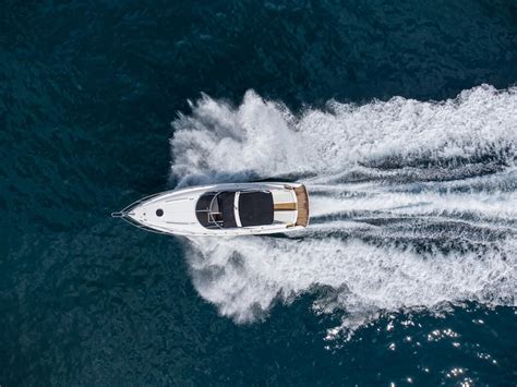 Premium Photo Aerial View Of Speed Motor Boat On Open Blue Sea